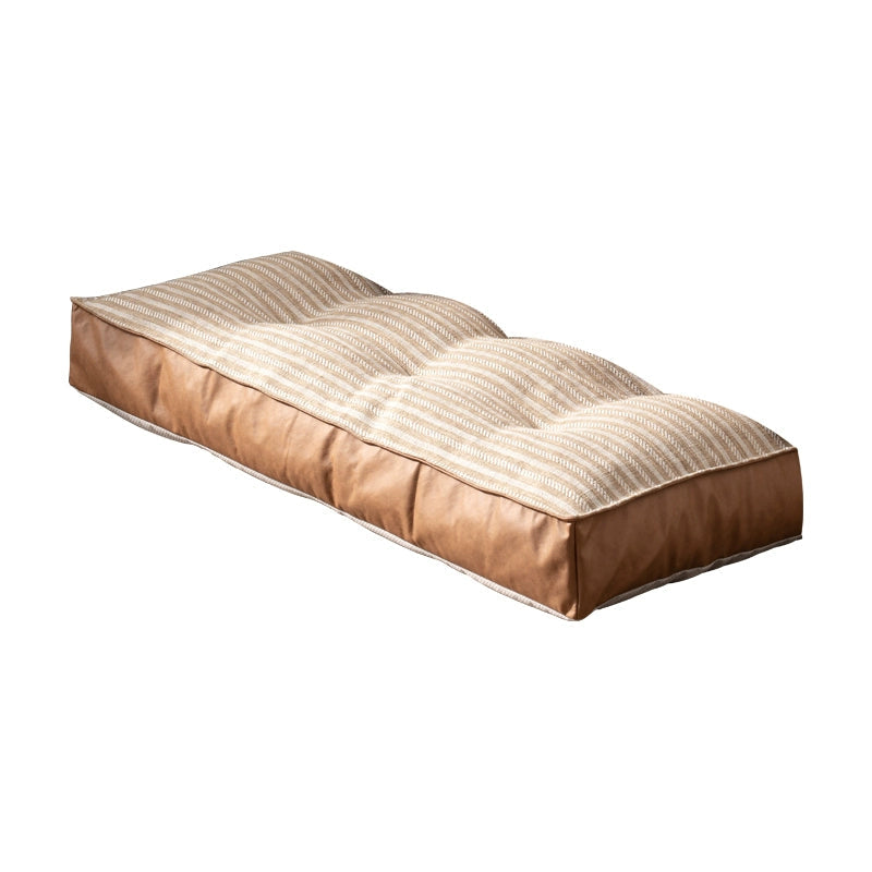 Modern Minimalist Floor Sofa with striped fabric and brown faux leather.