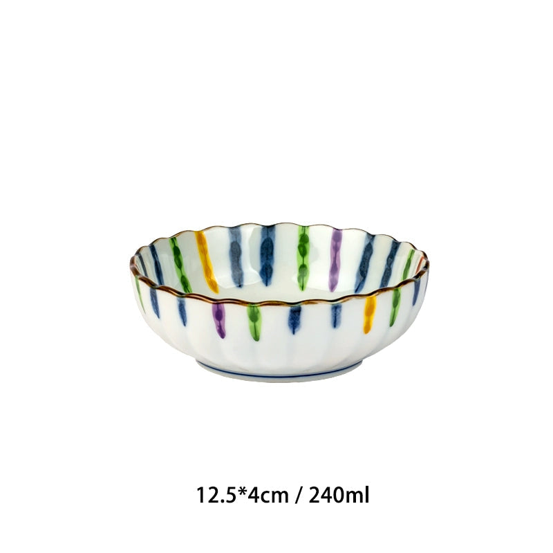 Colorful striped Japanese ceramic bowl with scalloped edge.
