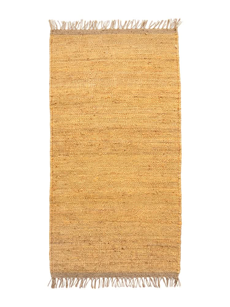 Handwoven Jute Rug, natural and rustic with fringed edges.