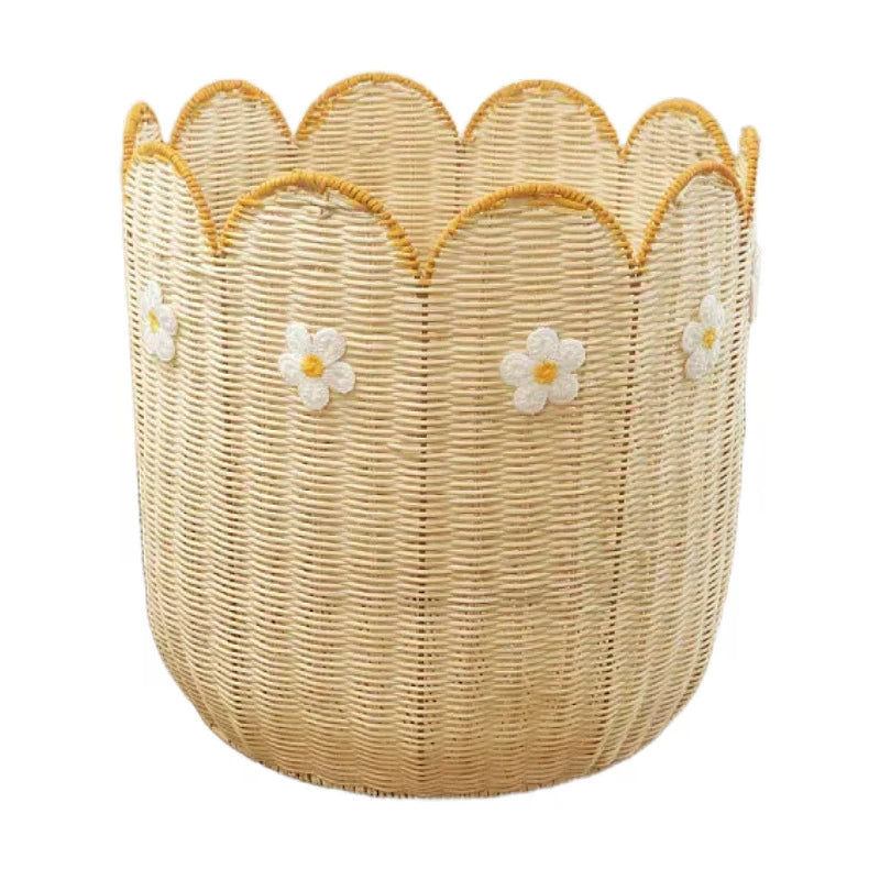 Light beige woven basket with scalloped edge and embroidered daisies.  Natural rattan.