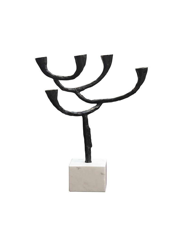 Modern black metal & marble candle holder with tree-like design on white marble base.