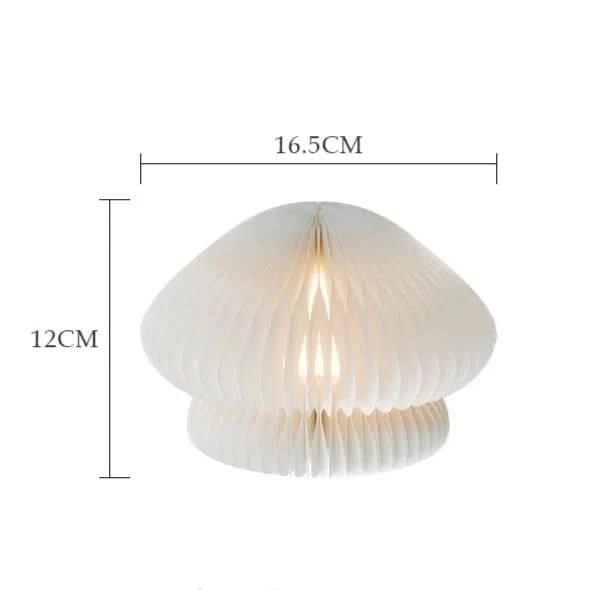 White paper origami mushroom bedside lamp, a unique home decor piece.