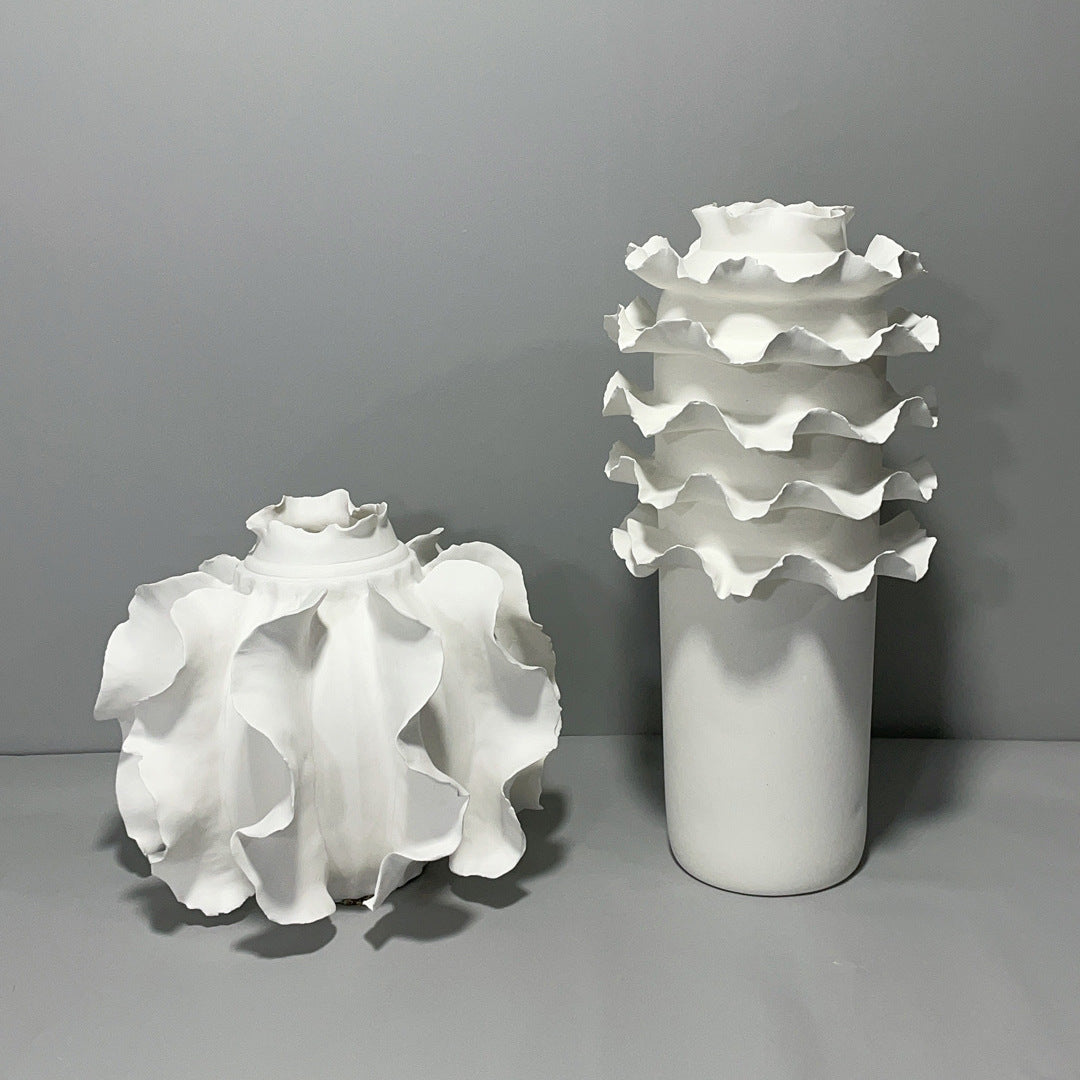 Elegant ruffled ceramic vase in white  