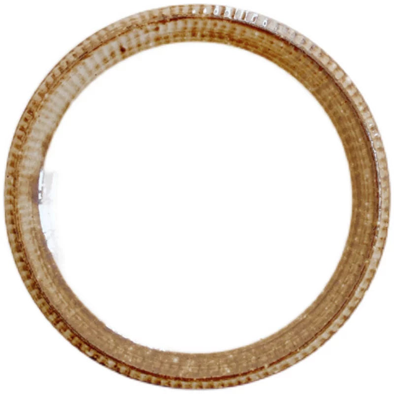 Single ceramic plate shown isolated, featuring a wide, textured brown rim and white center.
