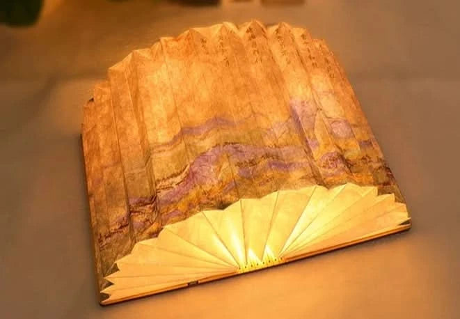 Brown & purple paper Customizable Book Paper Table Lamp, lit with warm light.
