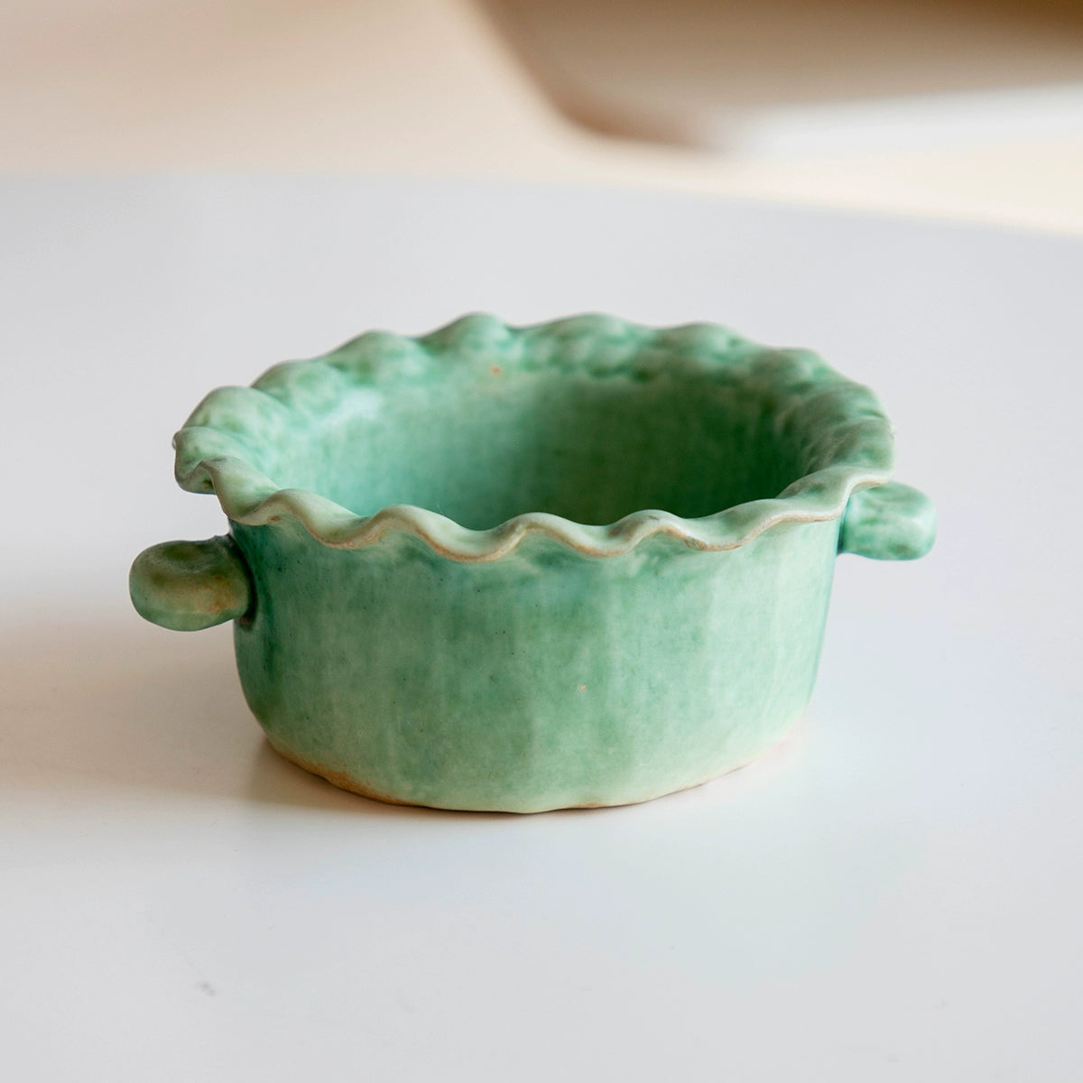 Green ceramic serving dish with scalloped rim and handles, part of the Hand-Painted Ceramic Serving Dishes - Green & Rose,...
