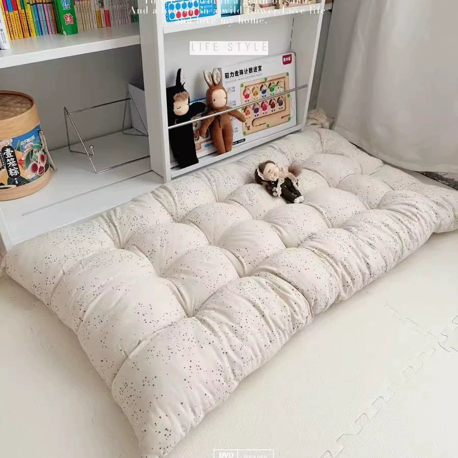 Beige dotted floor cushion with tassels, kids' play mat and floor seating