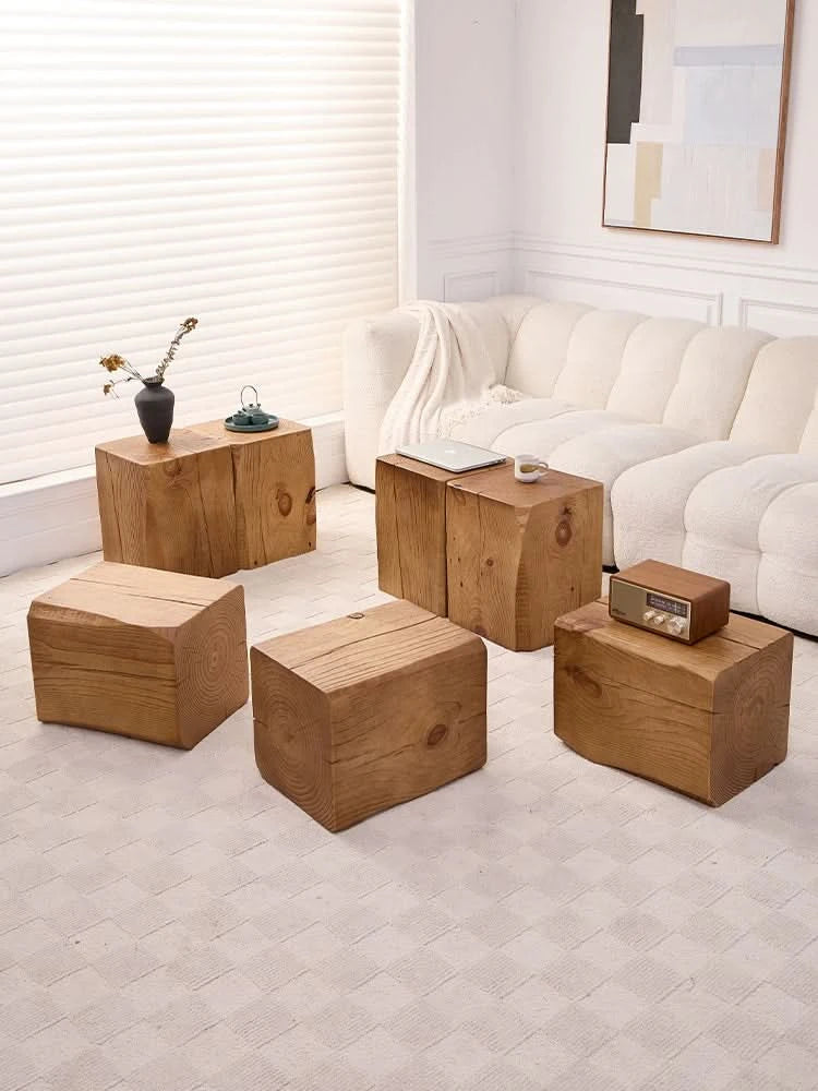 Rustic wooden coffee table wabi-sabi log cube side tables in a modern living room.