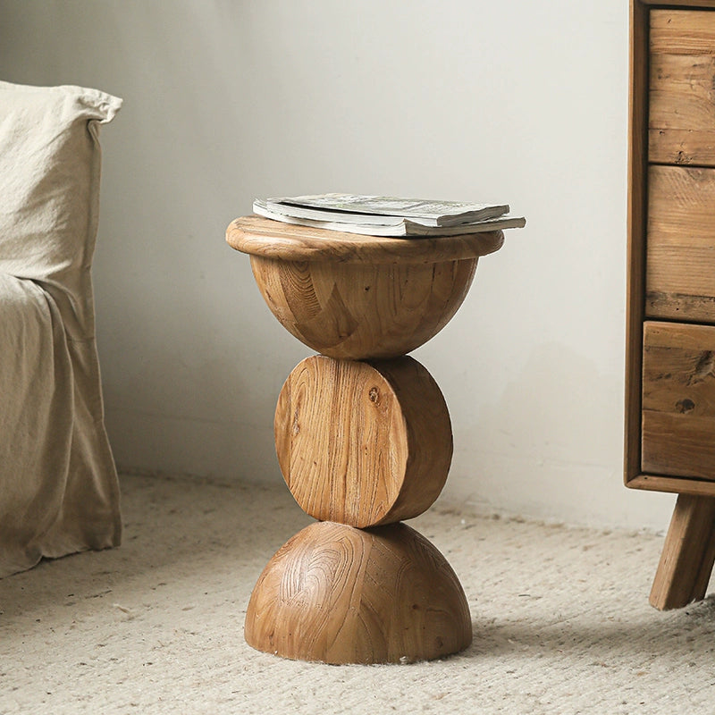 Bohemian Wooden Side Table, round, stacked design, natural wood finish, on beige rug.