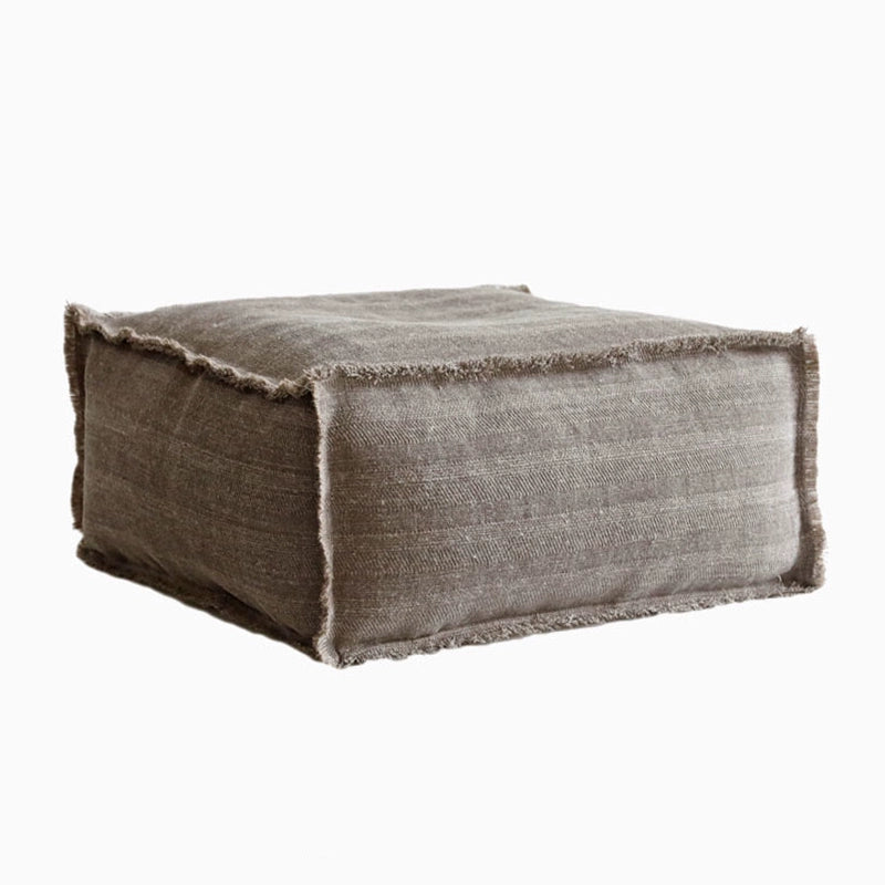 Rustic square fabric ottoman in warm taupe, textured linen, perfect for living room or meditation space.