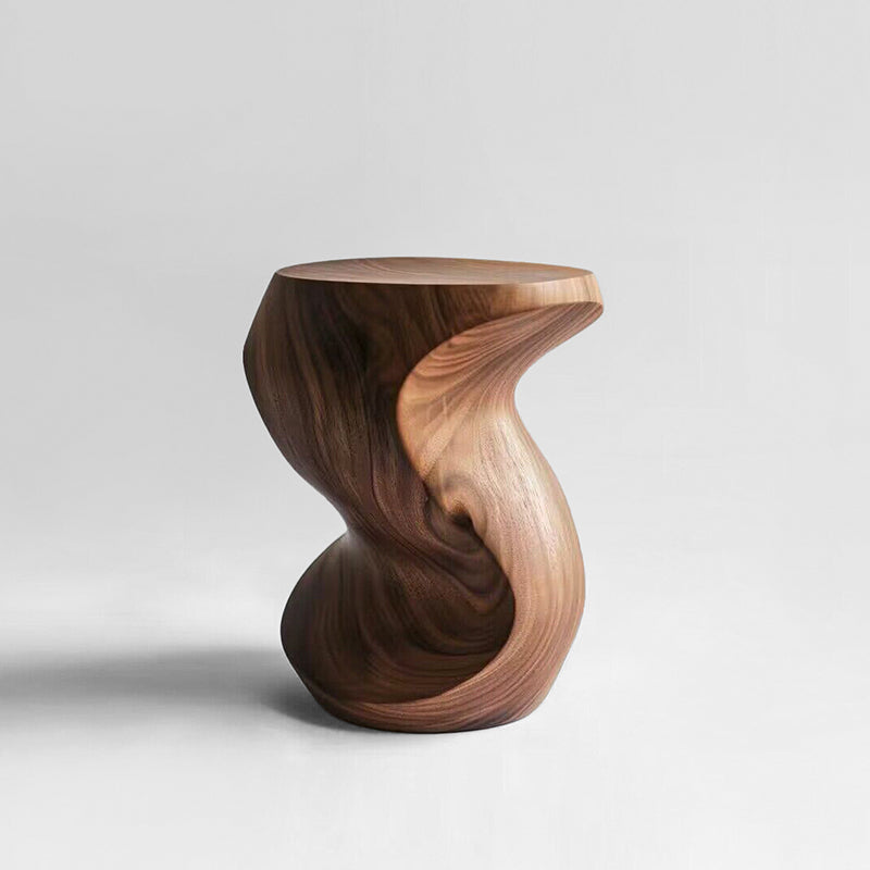 Hand-carved walnut wood pumpkin stool with organic, flowing shape on a white background.