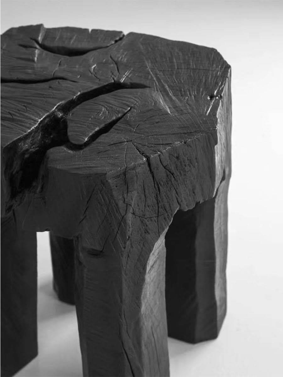 Dark, cracked Raw Wood Block Side Table with rustic texture on white background.