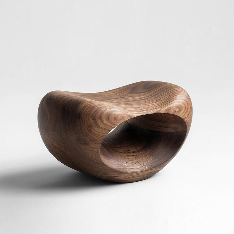 Hand-carved walnut wood pumpkin stool with natural grain, abstract sculptural home decor on white background.