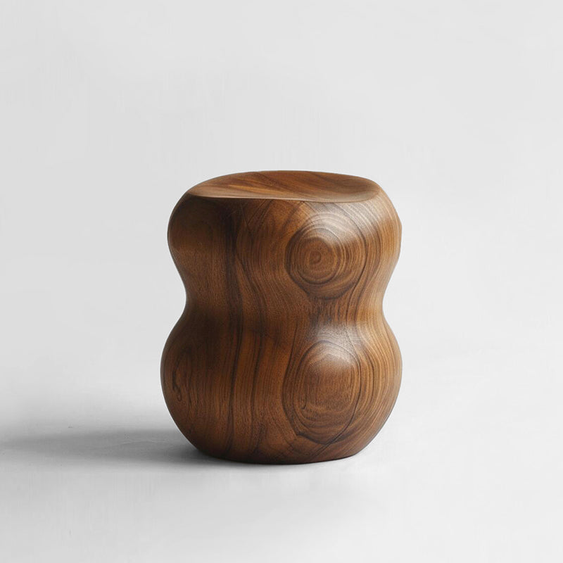 Hand-carved walnut wood pumpkin stool with rich grain, showcased on a white background.