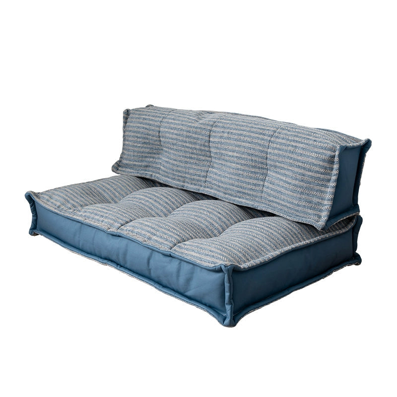 Modern minimalist floor sofa with blue and gray striped fabric and comfortable seating.