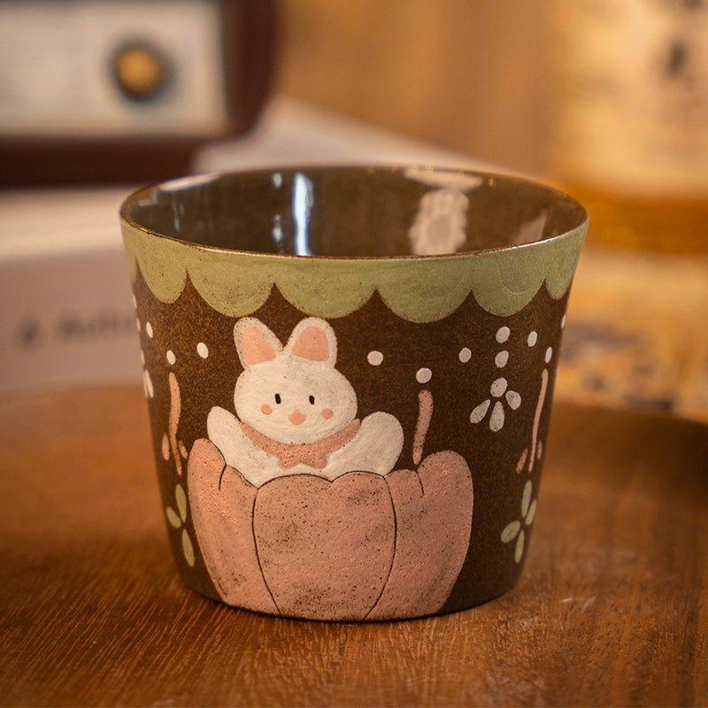 Hand-painted Japanese ceramic tea cup with a cute bunny, perfect for home decor or as a gift.