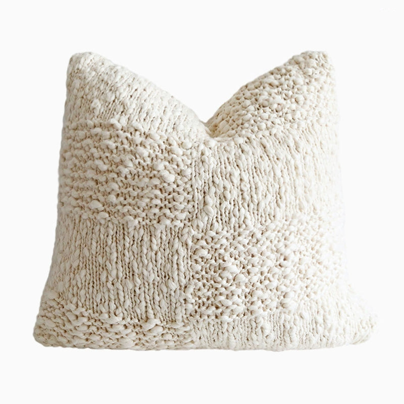 Cozy off-white knitted throw pillow with textured weave, part of a set of 4 decorative pillows.