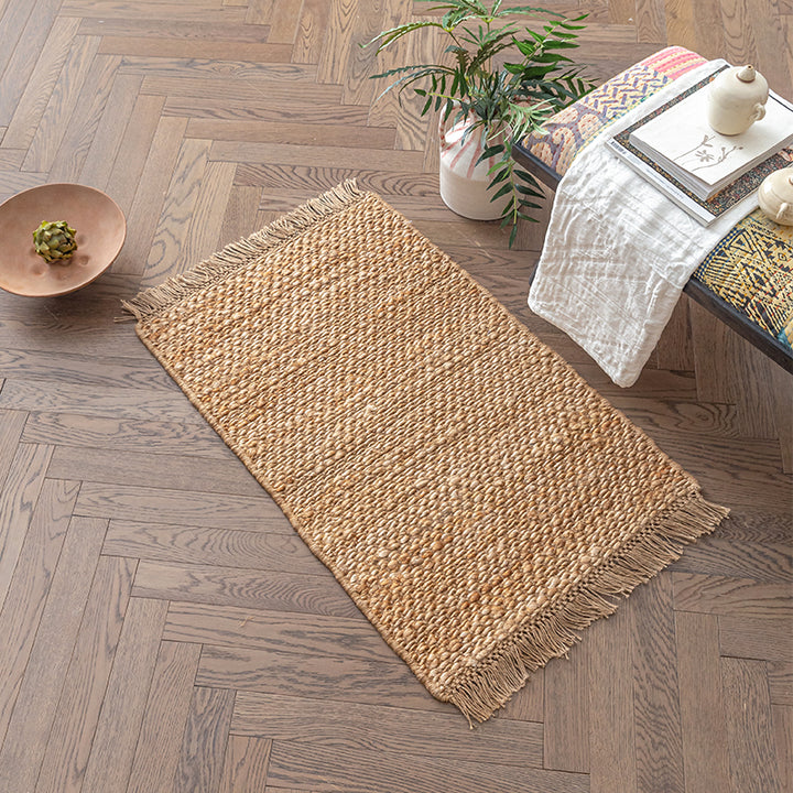 Beige woven rug with fringes