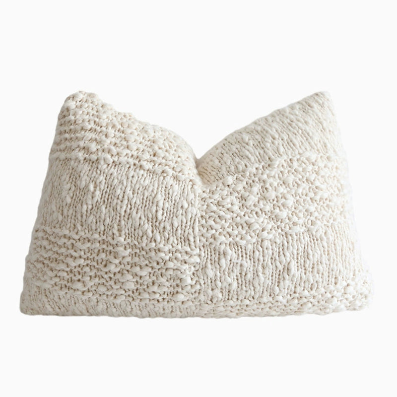 Cream knit throw pillow with textured pattern, part of a 4-piece set for home decor.