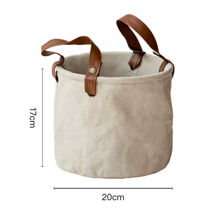 Rustic canvas plant pot with leather handles, beige, home decor.