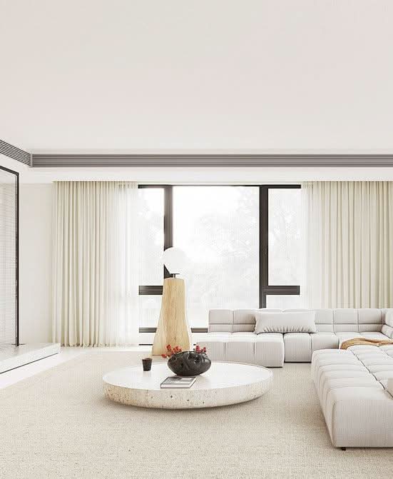 Natural Handwoven New Zealand Wool Rug in a modern living room with white sofa and coffee table.