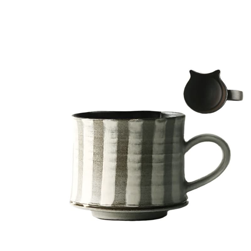 Rustic striped ceramic coffee cup with a black cat-shaped lid and handle.