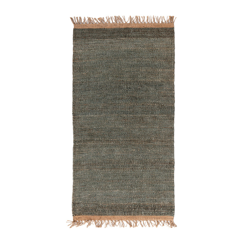 Terracotta handwoven jute rug with fringe.