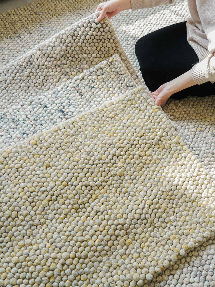 Hand-crafted wool rug with a textured