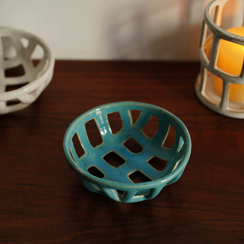 Nordic hollowed-out sesame glazed fruit dish, ceramic serving bowl, teal blue.