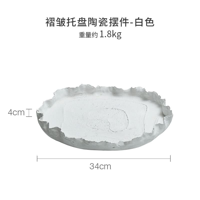 Wabi-sabi ceramic serving dish, white, textured, handcrafted home decor accent.