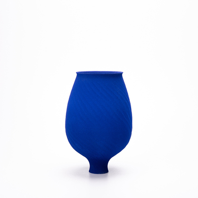 Klein Blue Flower Vase: Handcrafted ceramic vase with textured blue finish on white background.