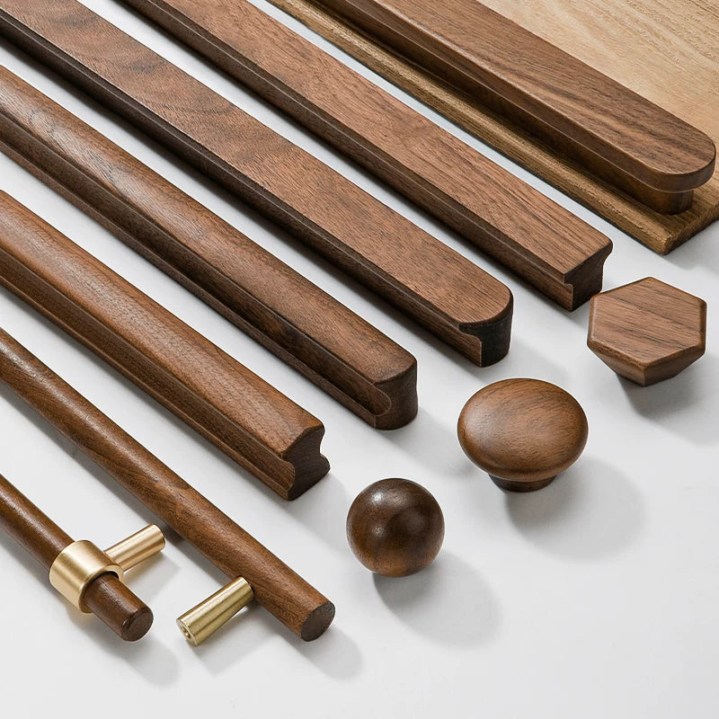 Various styles of dark walnut wood cabinet handles and knobs displayed diagonally.