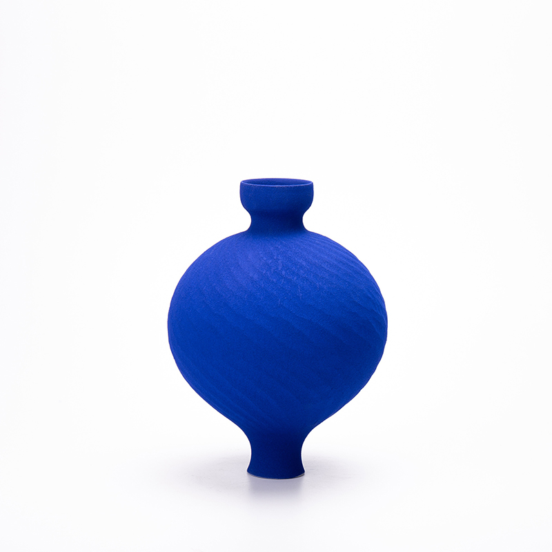 Klein Blue Flower Vase: Handcrafted ceramic vase with textured surface on white background.