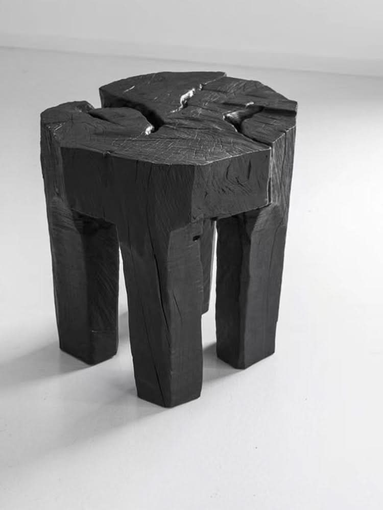 Raw wood block side table, natural charcoal finish, rustic home decor.