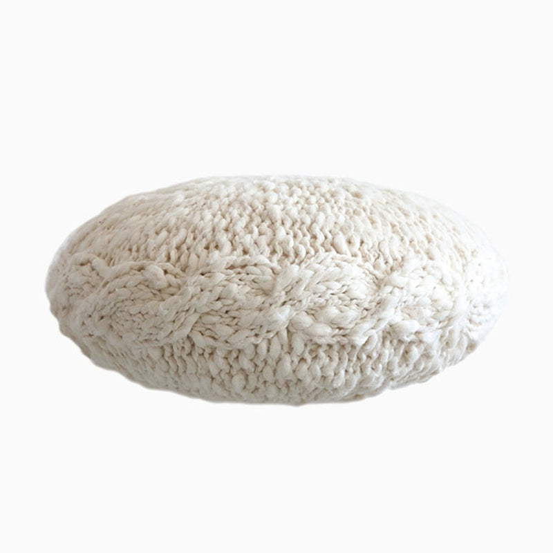 Cream cable-knit throw pillow, part of a set of 4 cozy decorative pillows.