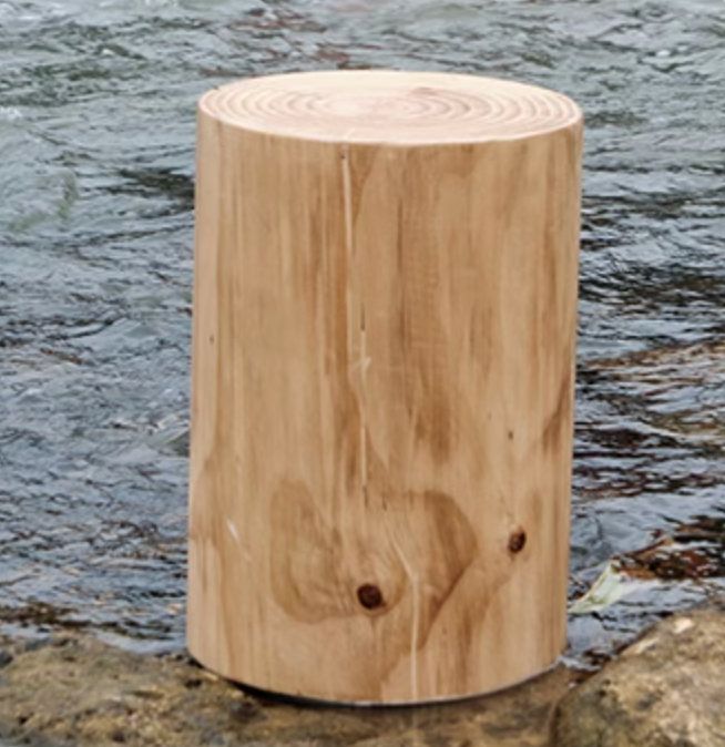 Natural wood log stool on river rocks, customizable size, home decor.