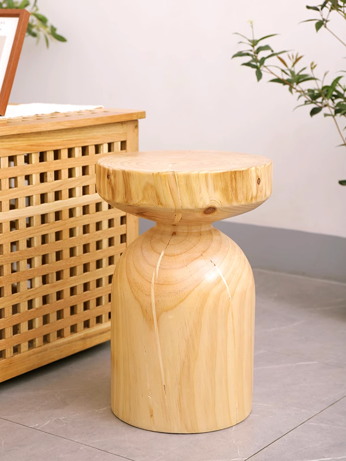 Natural wood stool with customizable size in a modern home setting.