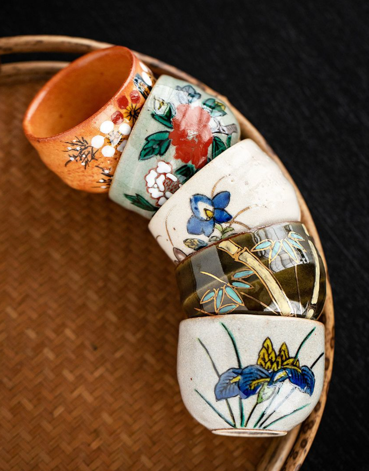 Five-Herb Flower Tea Cup Set: hand-painted ceramic cups with floral and bamboo designs.