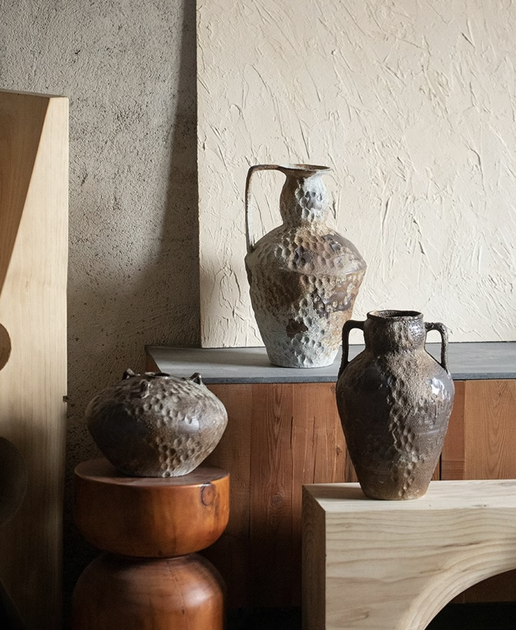 Wabi-Sabi Distressed Rustic Vases: earthy, textured ceramic vessels with handles, displayed in a home decor setting.