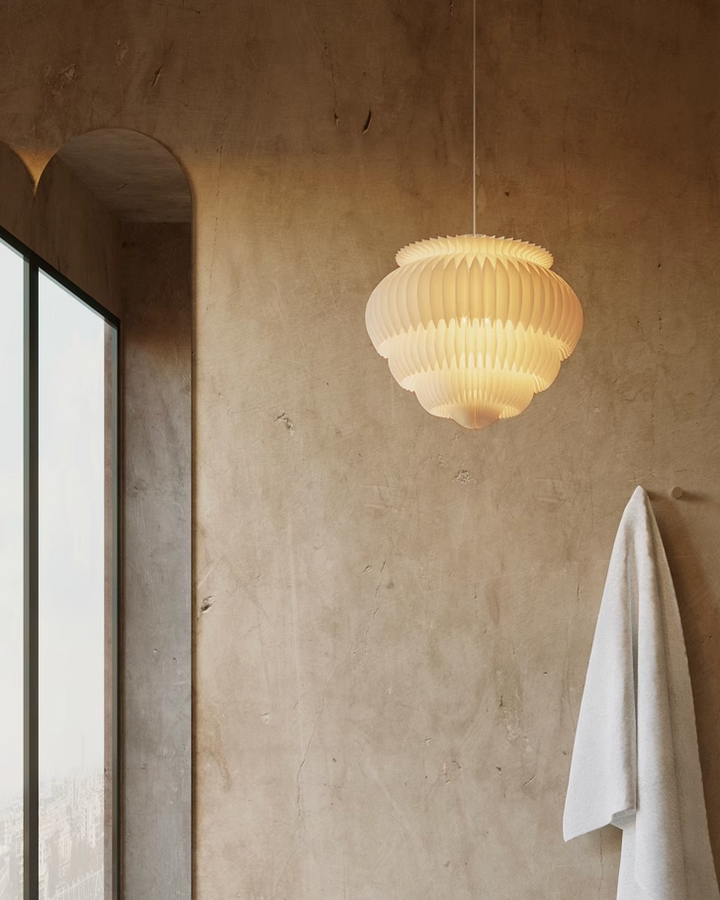 Cream origami lampshade, pleated design, soft light.