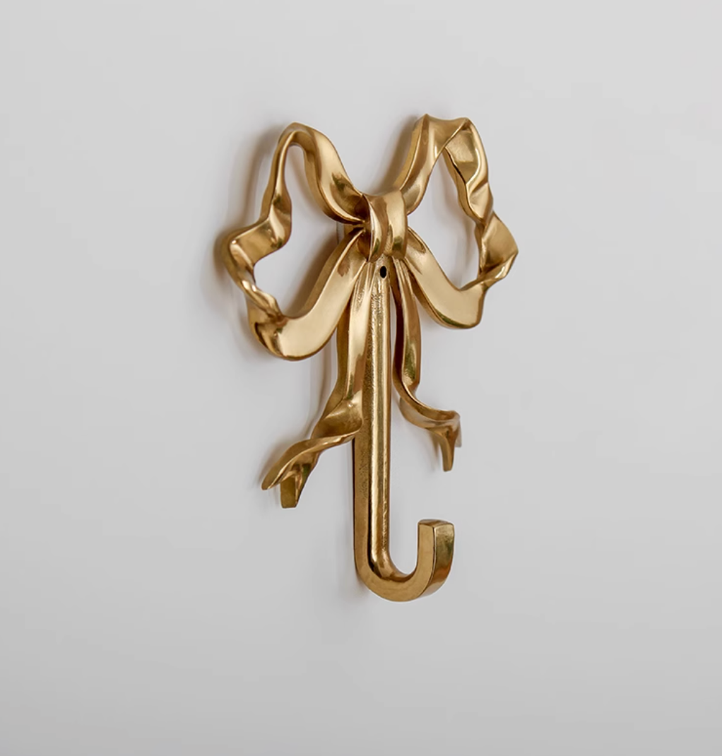 Shiny brass bow tie wall hook for home decor