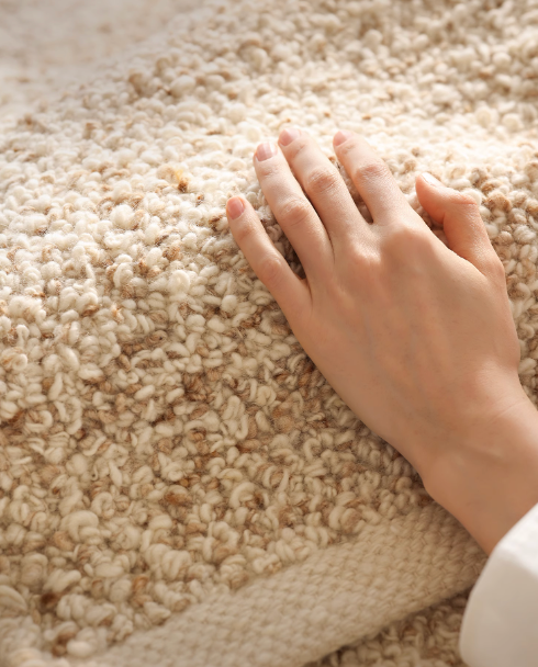Hand-Woven Wool Shaggy Rug in natural beige with textured pile.