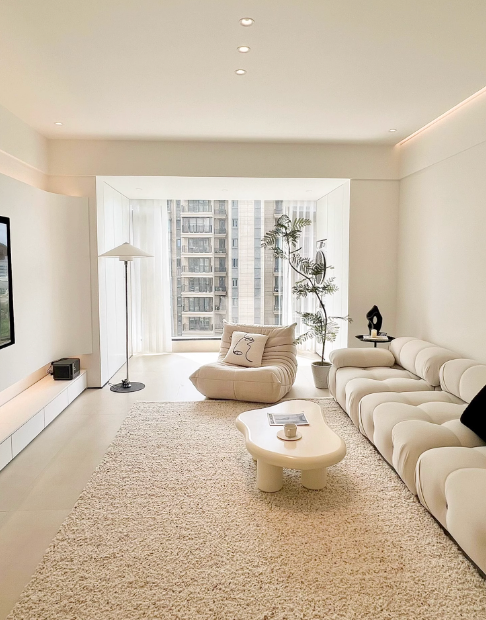 Creamy shaggy hand-woven wool rug in a modern living room.