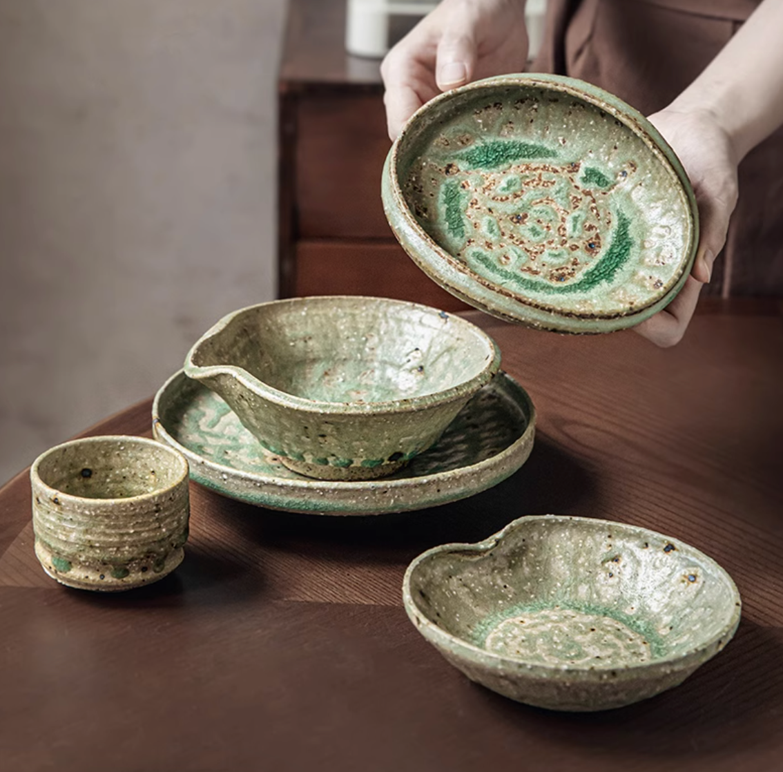 Artisan Green Dinnerware: textured ceramic bowls and plates in earthy green tones, home decor.