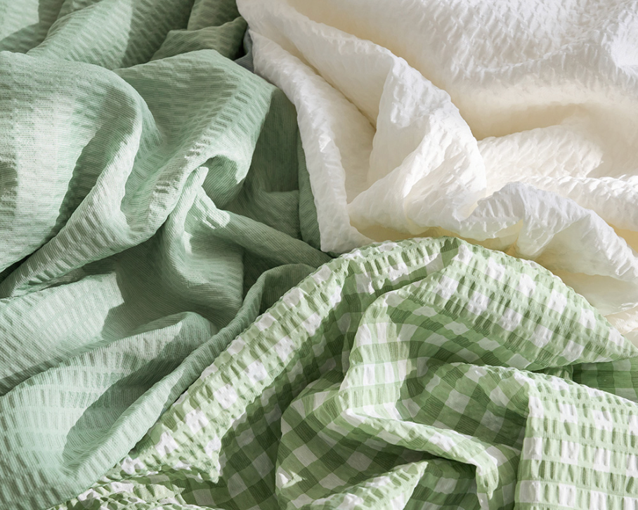 Green Gingham Sofa Protector & Rug Set: textured fabrics in sage green and cream.