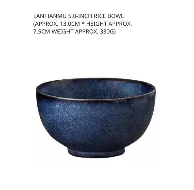 Close-up of a deep, dark blue speckled ceramic rice bowl (5.0 inch), isolated on white.