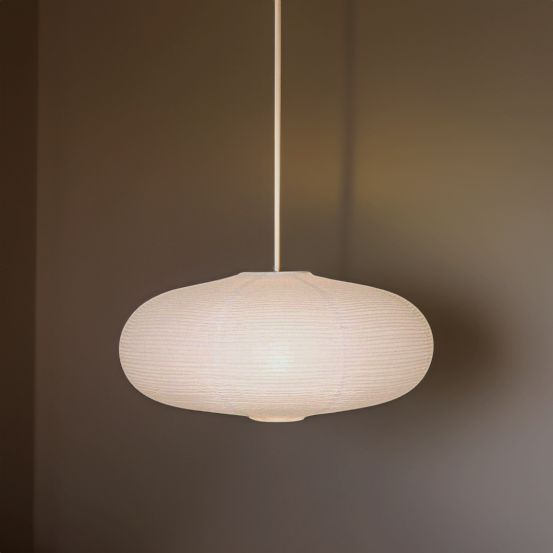 Japanese-inspired lampshade with paper oval, metal structure, and warm glow, perfect for various decor styles.