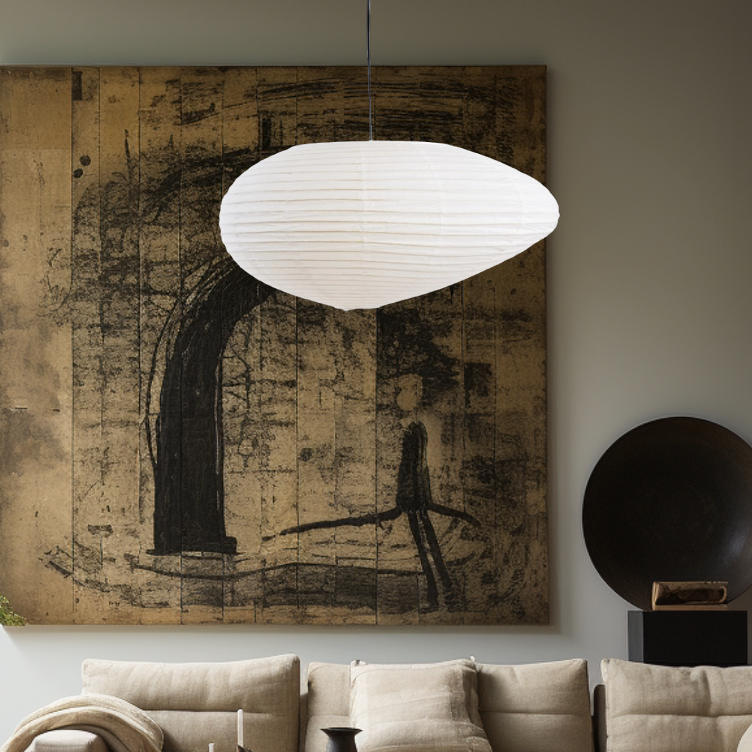 White paper lampshade with irregular shape, hanging in a modern living room.