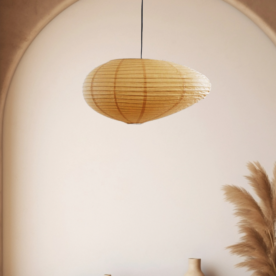 Irregularly shaped paper lampshades with soft light from ceiling. Feathers and vase close-ups.