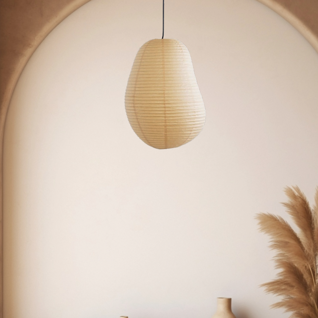 Irregular-shaped paper lampshade hanging from ceiling, casting soft light.